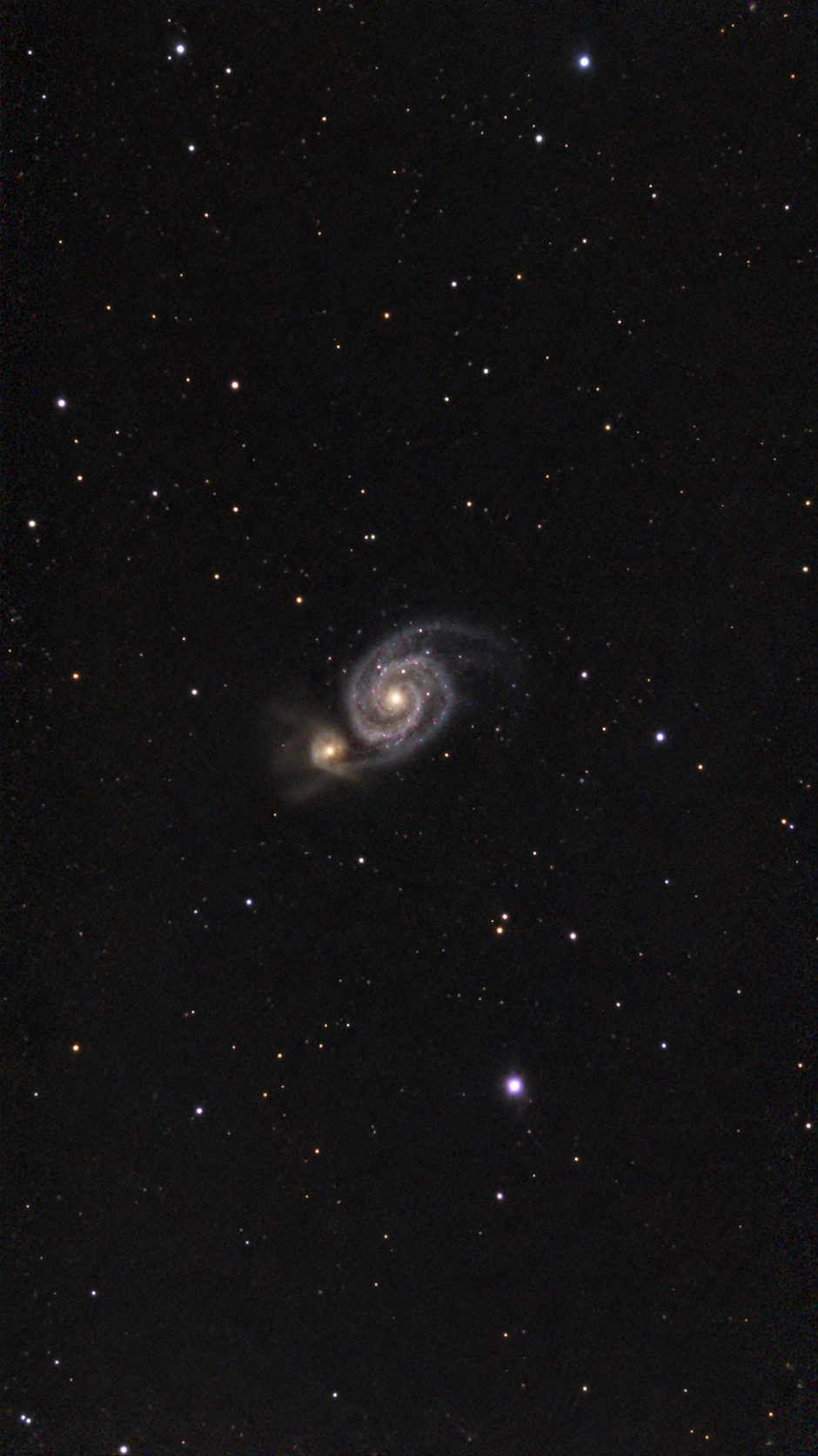 The Whirlpool Galaxy (M51) interacting with its companion galaxy NGC 5195